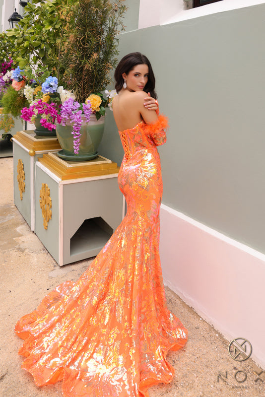 Step into the spotlight in the stunning Nox Anabel D1269 Sequin Mermaid Long Sleeve Prom Dress. With a flattering feather corset and intricate sequin detailing, this formal gown will make you feel like a star. Perfect for prom or any special event, stand out in style with this elegant and unique dress. Sizes: 0-16 Colors: Emerald, Fuchsia, Orange, Turquoise, White/Multi
