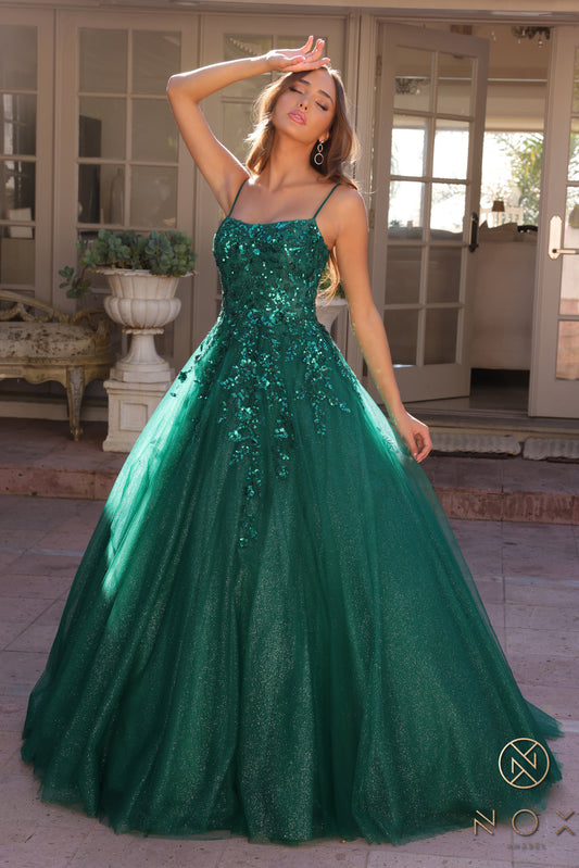 Introducing the Nox Anabel H1464 Prom Dress, the perfect blend of sophistication and glamour. Made with shimmery tulle and adorned with sequins, this A-line dress is designed to make you shine on your special night. With a flattering scoop neck and elegant pageant look, this dress will make you feel like a true star. Sizes: 0-16 Colors: Hunter Green, Hot Pink, Purple