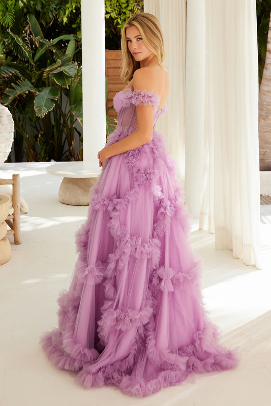 This Nox Anabel Y1472 prom dress features a unique combination of a sheer corset, tulle ballgown, and off-the-shoulder design. Expertly crafted with pleated ruffles, this dress is elegant and flattering, perfect for making a statement at any special occasion. Make a bold and sophisticated choice with this stunning dress.
Sizes: 0-16
Colors: Dusty Lavender, Fuchsia, Powder Blue, Red, Sage Green
