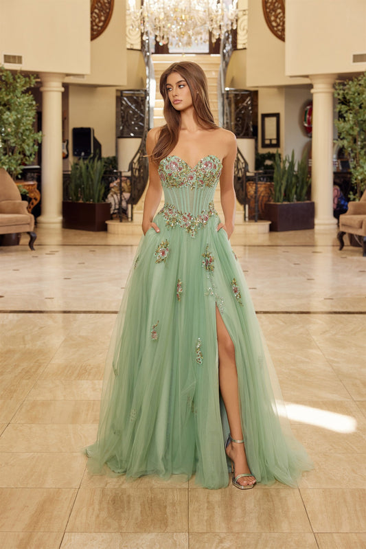 Make a statement in this stunning Nox Anabel Y1803 prom dress, designed for those who embrace bold elegance. The strapless silhouette features a sheer floral corset bodice that commands attention, while the dramatic slit and flowing train add movement and sophistication. The backless design creates an alluring, modern look perfect for prom night or formal events. Crafted with premium construction, this dress combines intricate detailing with flattering tailoring for an unforgettable entrance.
Sizes: 00-16