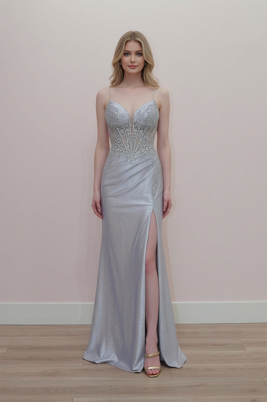 Elevate your prom night with the Nox Anabel D1768, a stunning sheer beaded sequin corset gown designed to turn heads. This sophisticated dress features a plunging V-neckline, delicate spaghetti straps, and an intricately beaded corset bodice that creates a flattering silhouette. The sheer sequin detailing catches light beautifully, while the dramatic slit and flowing train add movement and elegance. Perfect for those seeking a bold, glamorous statement piece that balances allure with refined style.
Sizes: