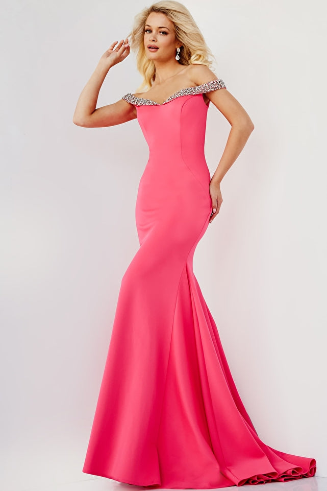 Expertly crafted from stretch fabric, this Jovani prom dress style JVN08436 is a stunning choice for any formal event. The fitted bodice features a semi sweetheart neckline with off-the-shoulder crystal embellishments, adding a touch of sparkle. The mermaid bottom and sweeping train accentuate your figure and create an elegant silhouette. Step out in style with this glamorous evening gown.  Sizes: 00-24  Colors: Cerise, Coral, Cobalt, Fuchsia, Periwinkle