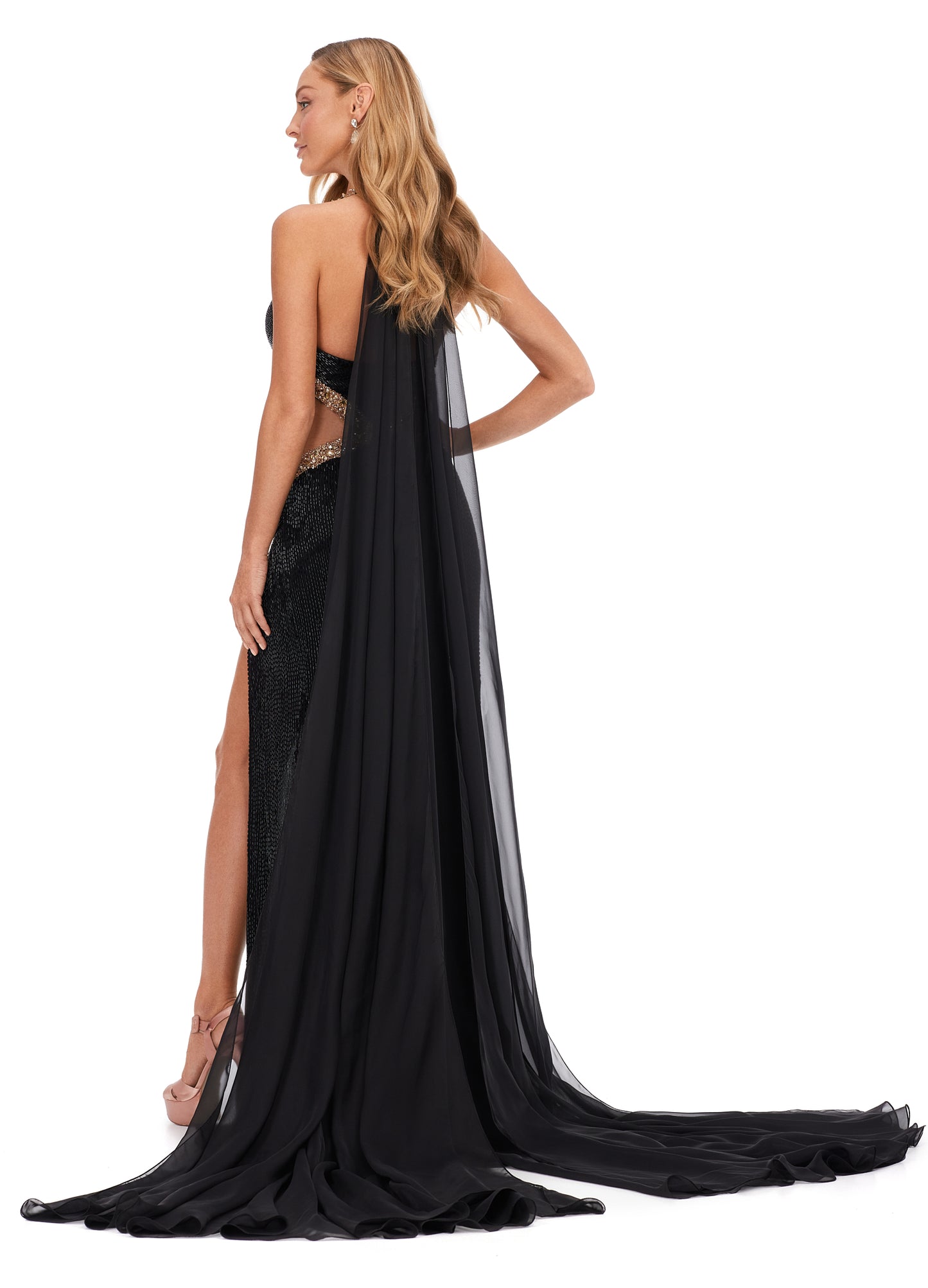 Ashley Lauren 11399 Halter Neckline Liquid Beaded Chiffon Cape Illusion Cut Outs With Crystal Detail Formal Dress . Sparkle from every angle in this elegantly detailed gown. The liquid beading is met with crystal accents that follow the dresses cut outs. With a gorgeous flowing cape, this dress is going to make you feel and look glamorous!