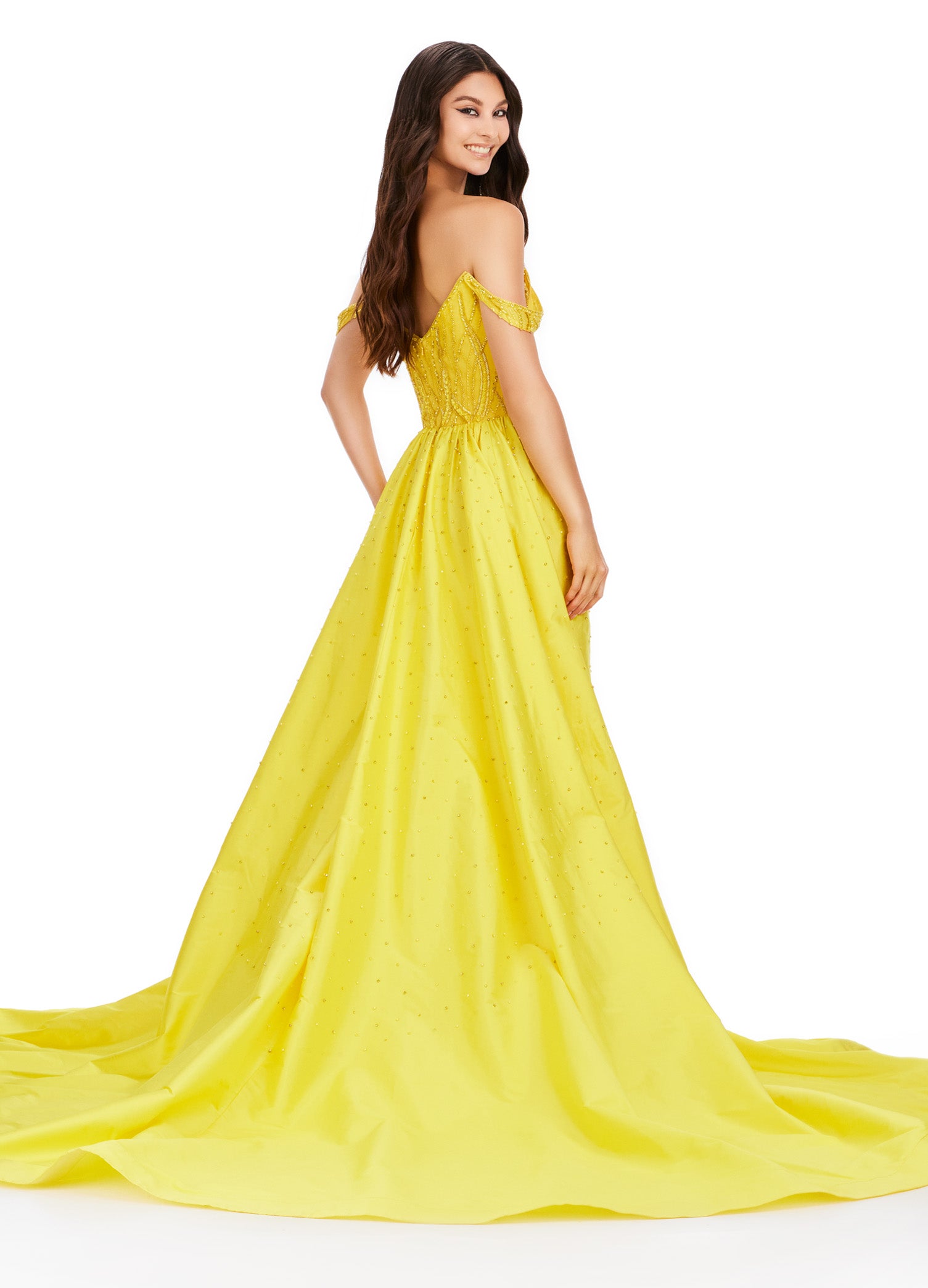 Elevate your evening look with the Ashley Lauren 11458 Long Prom Dress. This fully beaded strapless gown features a flattering off shoulder neckline and a unique draping taffeta overskirt. Perfect for formal occasions and pageants. Regal and fabulous? We got you. This fully beaded gown features an off shoulder sweetheart neckline and a dramatic taffeta overskirt to help you slay at your next event.