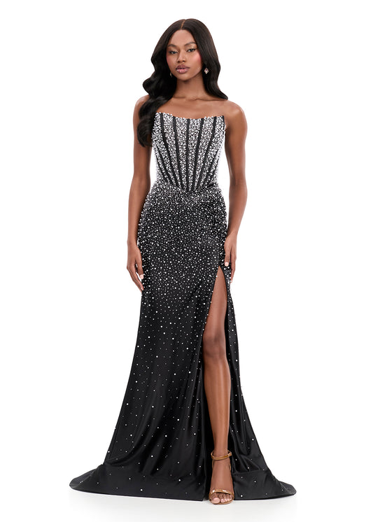 ASHLEYlauren Style 12356 is a fully beaded evening gown that commands attention with its fitted silhouette and strapless neckline. Ashley Lauren 12356 The expertly contoured bodice features vertical beadwork that accentuates the waist and elongates the figure, while a sweeping train with slit adds dramatic movement. Crafted from jersey fabric with pearl corset bustier detailing, this gown delivers high-impact sparkle from every angle. Ideal for pageants, red carpet events, prom, galas, and special occ