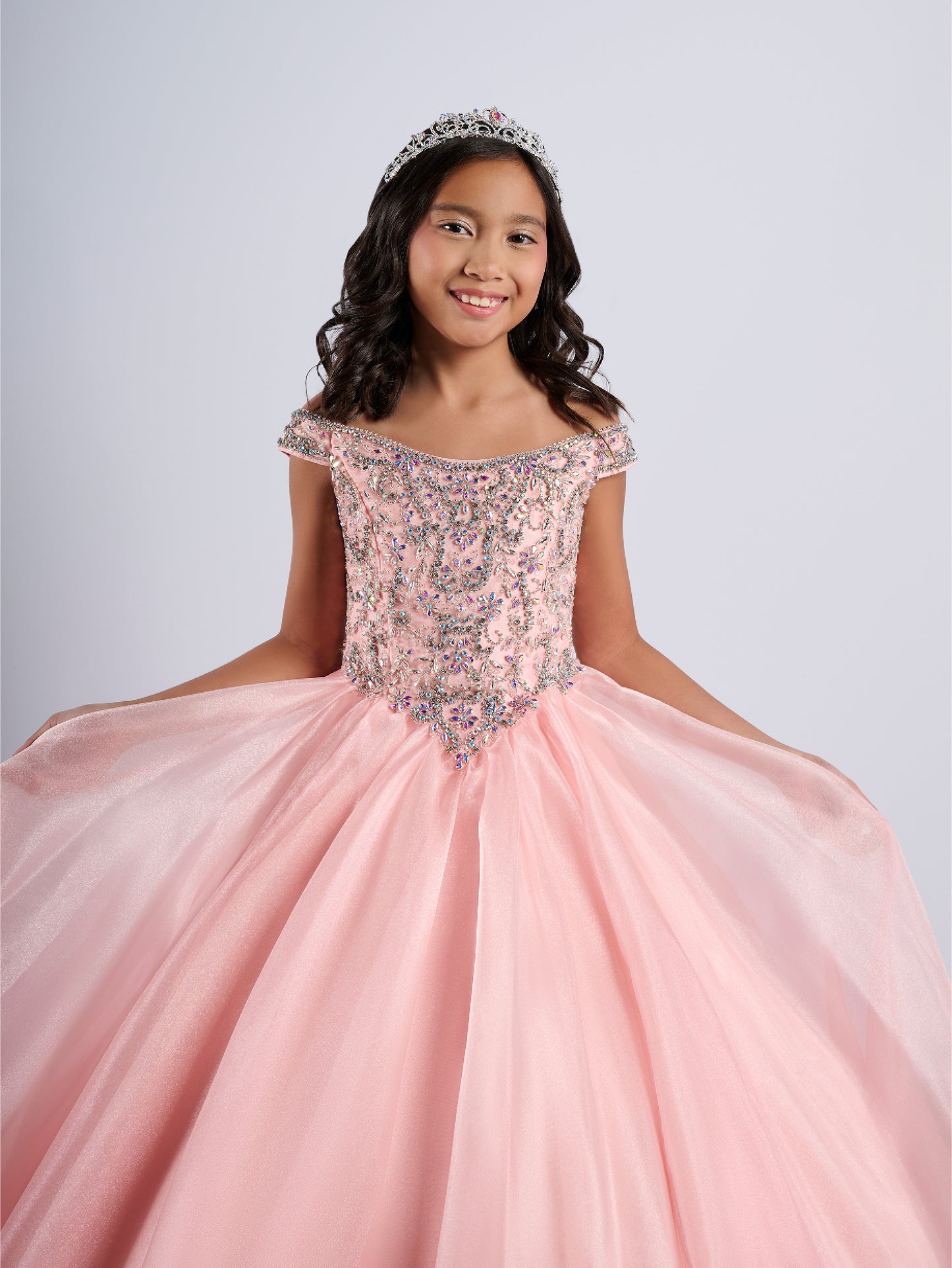 Elevate your little girl's pageant game with the Tiffany Princess 13788 dress. The stunning crystal bodice sparkles underneath the off-shoulder ballgown, making her stand out on stage. The A-line cut flatters any figure, creating a timeless and elegant look for any pageant.
Sizes: 2-16
Colors: Blush, Royal, White
