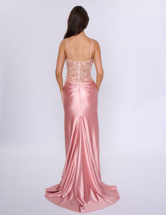 Look stunning at prom or any formal event with the Nina Canacci 1585 Fitted Sequin Long Prom Dress. This figure-hugging gown features a flattering ruched V-neckline and a daring thigh-high slit. The sequin fabric adds a touch of glamour and the long length will make you stand out.
Sizes: 0-14
Colors: Black, Emerald, Rose Gold