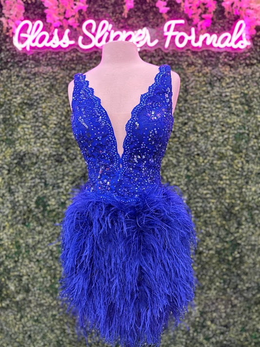 Johnathan Kayne 2314 Cocktail Dress. This is a short lace V neckline cocktail dress with scalloped edges in the neckline. The skirt is feathers. Strut in your next event or pageant in this fun cocktail dress. Colors: Royal Size: 10 Fabric: Stretch Lace, Stretch Lining