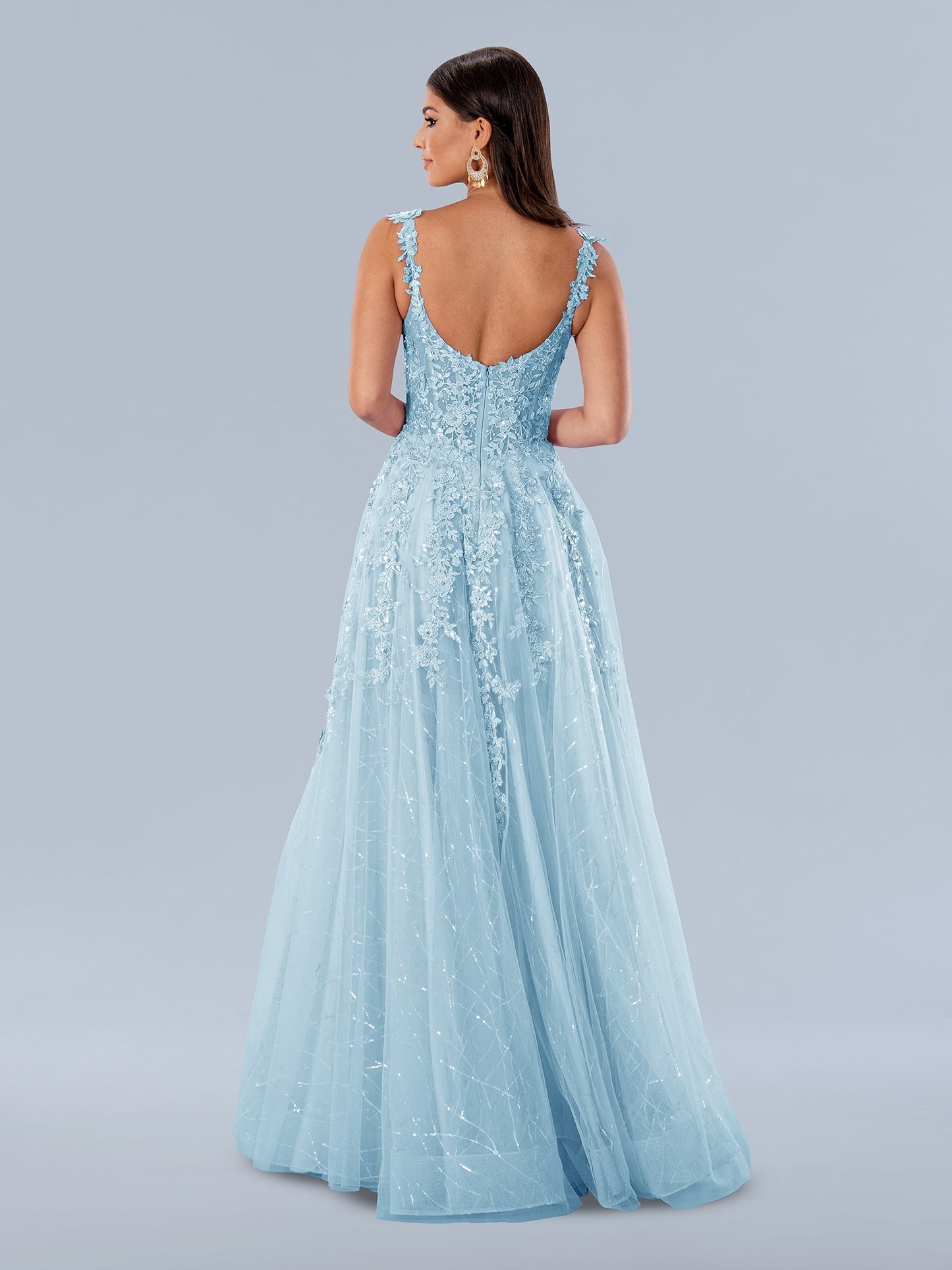 Stella Couture 24199 long A-line dress features a sheer lace corset bodice, maxi slit, and Iridescent sequin accents. This formal gown is ideal for making a lasting impression. The timeless design is perfect for proms, weddings, and more. Sizes: 0-24 Colors: Blue, Lilac