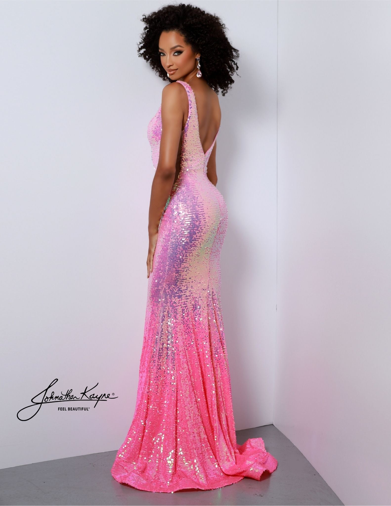 Be the belle of the ball wearing this Johnathan Kayne 2829 Long Prom Dress. It features a V neck and high slit, embellished with ombre sequins for extra sparkle. This formal pageant gown is perfect for your grand entrance. Sizzle and stun the room! Our Ombre Sequin Mesh gown featuring detachable feathered rhinestone chains and a slit will leave everyone talking at your next event!
