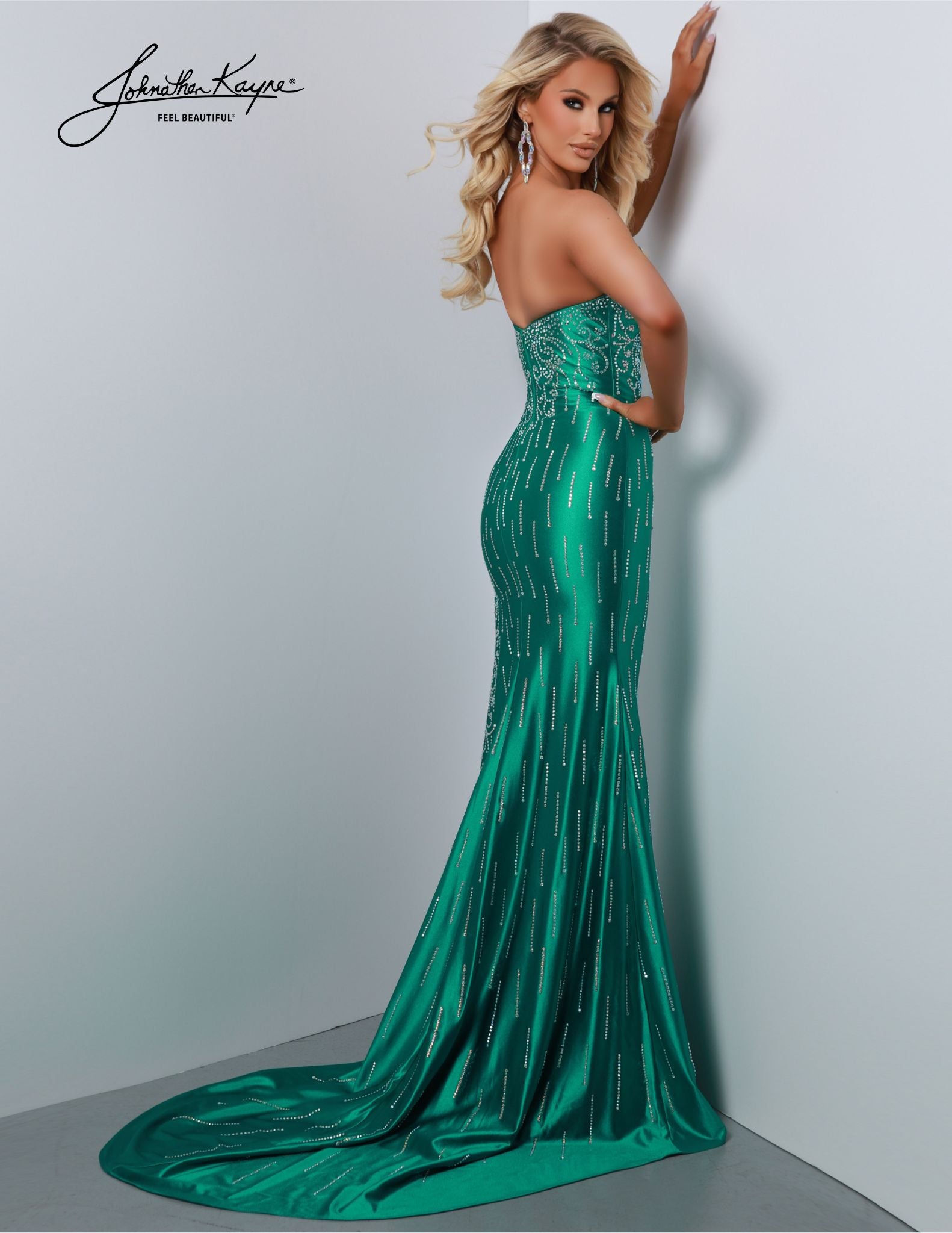 Johnathan Kayne 2875 is the perfect prom dress for any formal occasion. This long gown features a strapless mermaid silhouette with an open back, slit, and sweetheart neckline. The high quality fabric and construction make this dress a fashionable option for any special event. Prom night is all about creating unforgettable memories, and our Shiny 4-Way Stretch Lycra strapless gown with a daring slit is your perfect choice. 