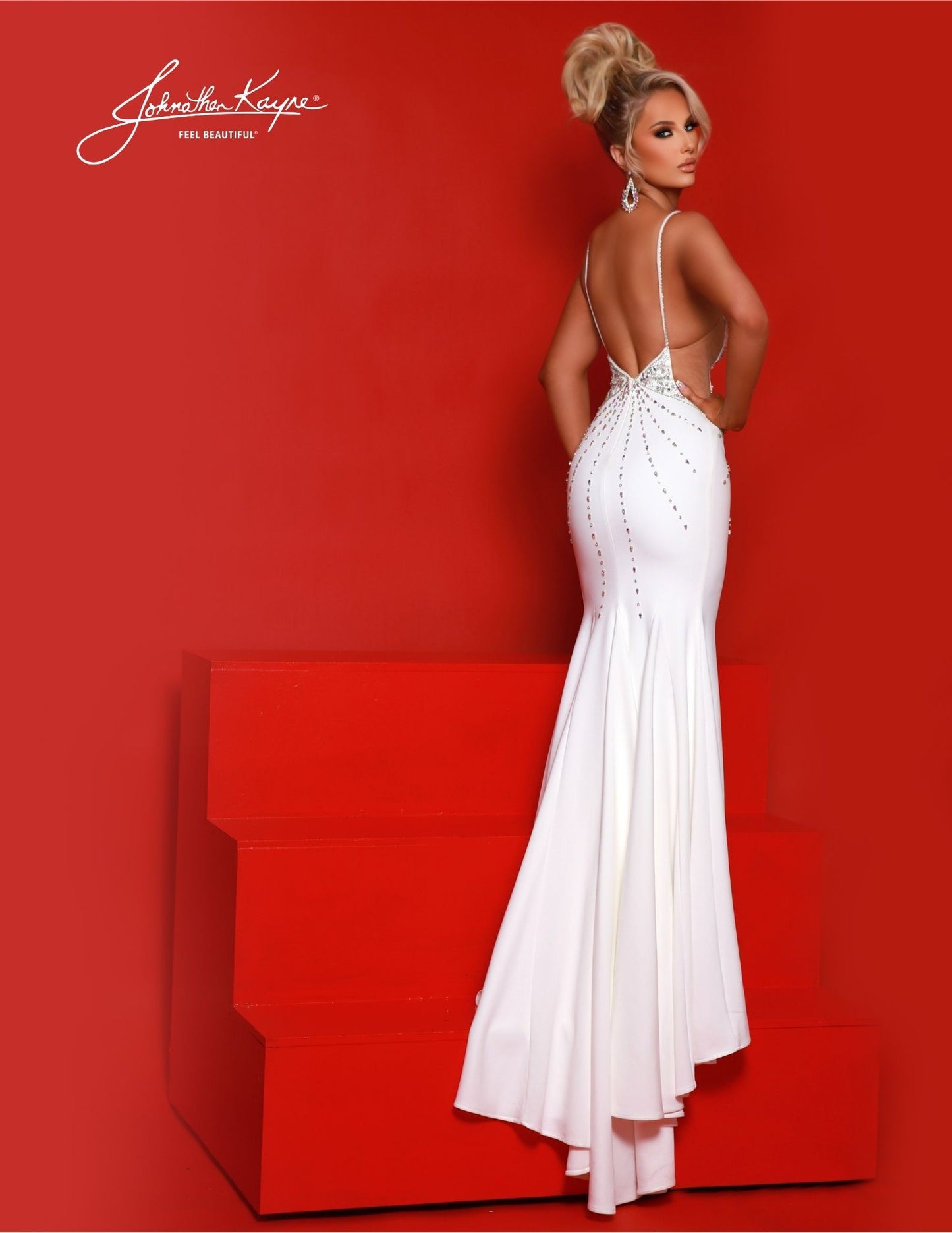 The breathtaking Johnathan Kayne 2881 Long Prom Dress dazzles with a fitted V- neckline, cut out, slit,  train, and formal pageant gown. The sleek silhouette and chic design make it perfect for a special occasion. Elevate your style and make a lasting impression with this heavy knit gown. Featuring sultry side cutouts, a low V-neckline, and a daring thigh-high slit, this dress is designed to capture attention and leave onlookers in awe.