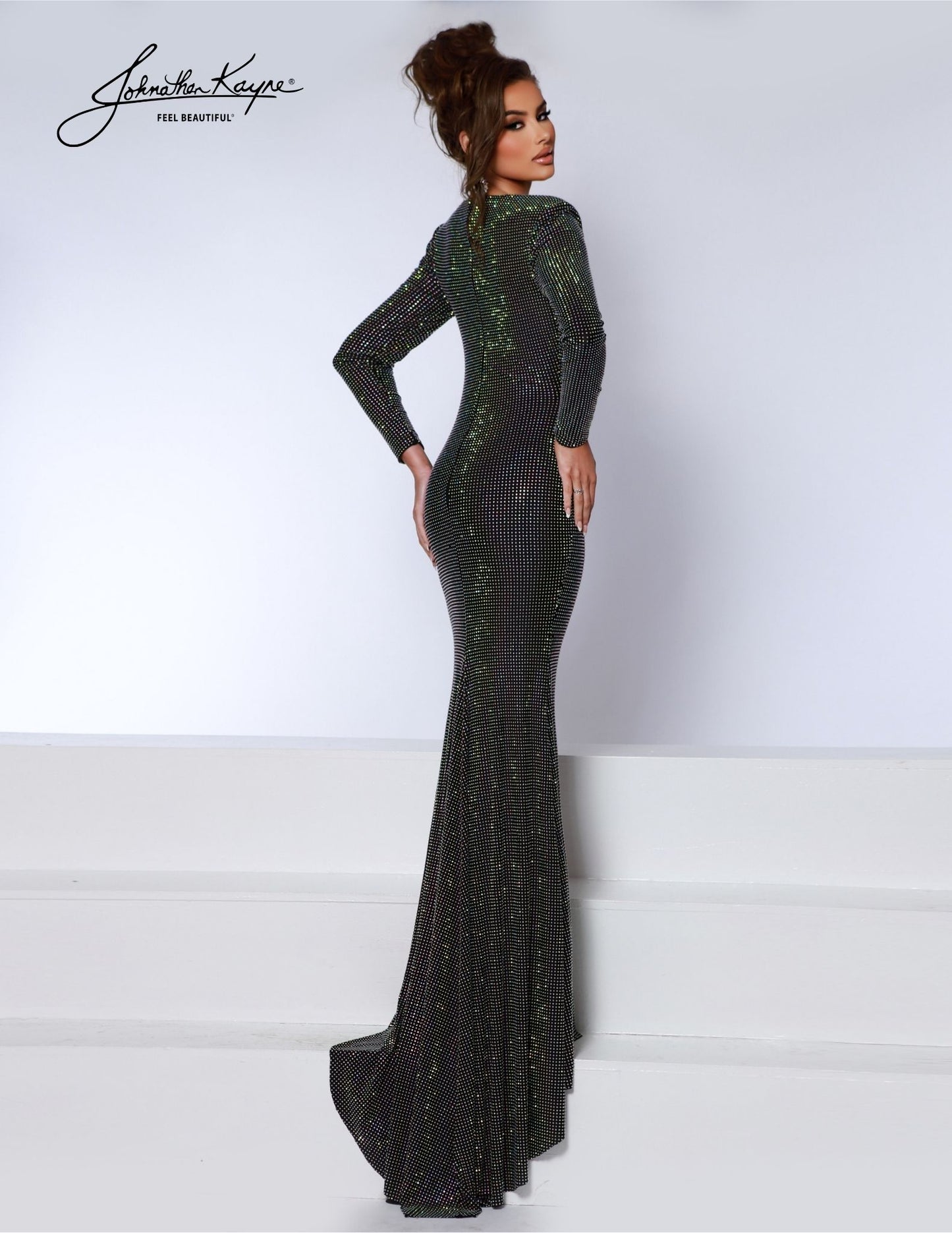 Experience elegance and sophistication with the Johnathan Kayne 2901 Crystal Studded Long Sleeve V Neck Formal Dress Ruched Gown. This stunning gown features a crystal-studded bodice, long sleeves, and a v-neckline for a classic and timeless look. The ruched gown adds a touch of femininity and elegance, making it the perfect choice for any formal occasion. With its superior design and high-quality construction, this dress is sure to make you stand out and leave a lasting impression. 