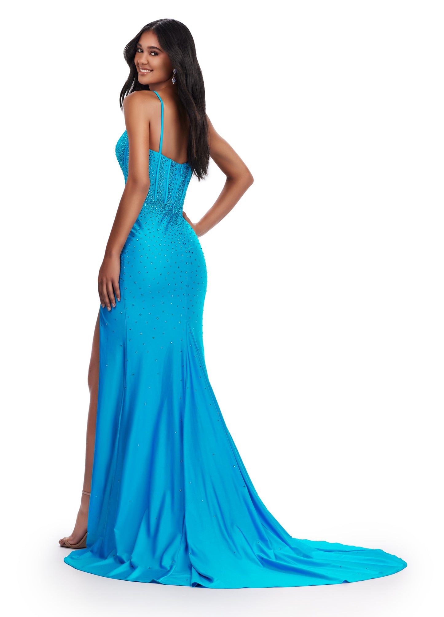 This Ashley Lauren 11668 prom dress is a sleek, fitted jersey gown with a corset bodice and plunging V-neckline. The dress also features a dramatic slit, adding a touch of sophistication and showcasing your legs. Perfect for formal events, this dress will make a stunning statement.