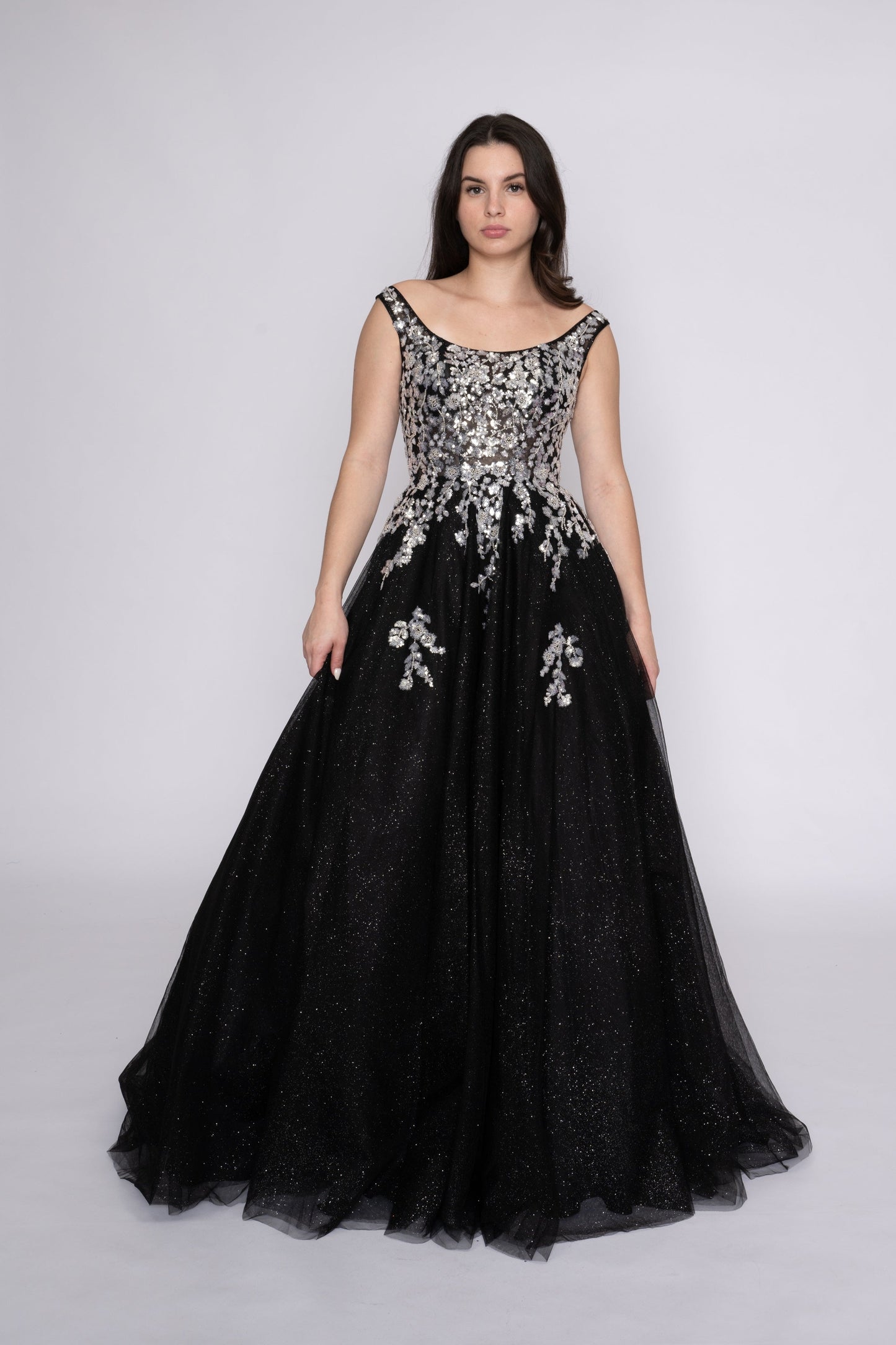 Step onto the dance floor in style with the Nina Canacci 3266 Shimmer Sequin Prom Dress. This A Line plus size ballgown features a scoop neck and shimmering sequin fabric for a glamorous look. Perfect for formal events, this dress is sure to make you stand out and feel confident all night long.
Sizes: 12-24
Colors: Fuchsia, Lilac, Black/Silver