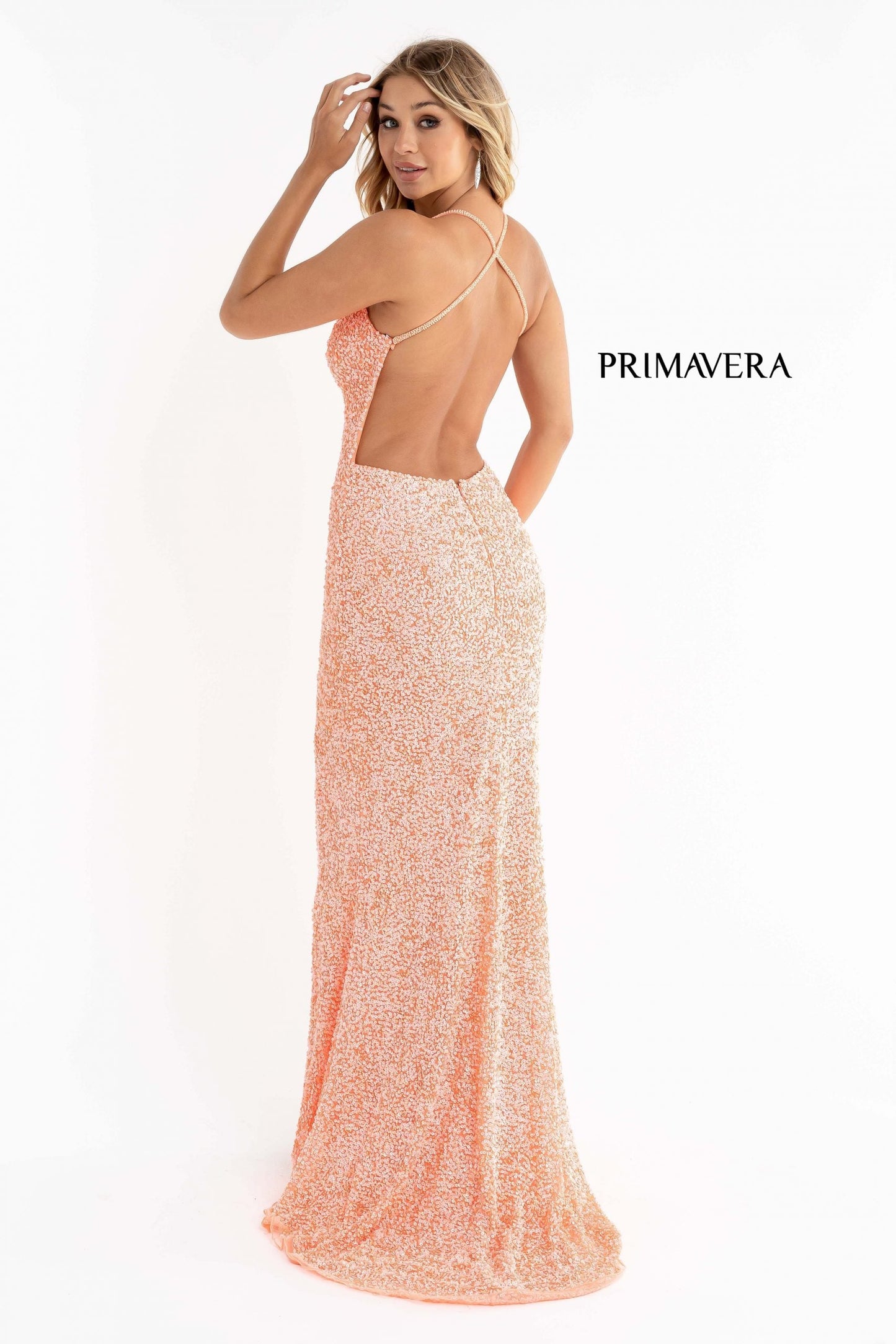 Primavera Couture 3291 Exclusive Prom Dresses. This long prom dress is embellished throughout with shimmering sequins. This impressive gown showcases a v neckline, thin beaded straps and crisscrossed straps in the open back. The long slim skirt has a sultry high side front slit. v
