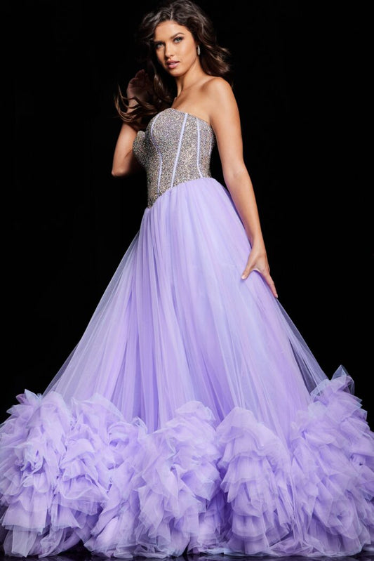 As a formal gown expert, trust the Jovani 37199 Ruffle Tulle A Line Dress to elevate your prom or pageant look. With a stylish crystal corset and elegant ruffle tulle A line design, this gown exudes sophistication. The slit adds a touch of allure, making you stand out from the crowd. 
