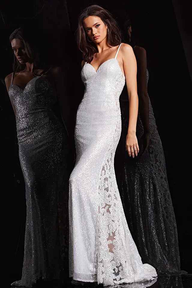 The Jovani 37648 is a show-stopping formal dress designed to make a glamorous statement. The dress is crafted from a combination of sequin and mesh materials, creating a stunning and luxurious texture. The fitted style accentuates the curves of the wearer, providing a sleek and sophisticated silhouette.  One of the distinctive features of this dress is the sheer sides adorned with beaded embroidery. 