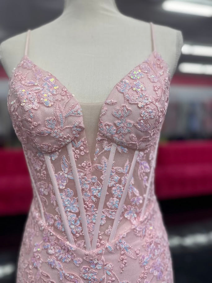 Elevate your formal occasion with the Nina Canacci 4434 gown, designed in a delicate peach hue. This size 4 mermaid dress features a sheer lace corset bodice adorned with subtle sequins, creating an elegant shimmer. The flattering V-neckline enhances your silhouette, while the fitted mermaid skirt offers a graceful, sophisticated finish perfect for prom or any special event.
Size: 4
Color: Peach