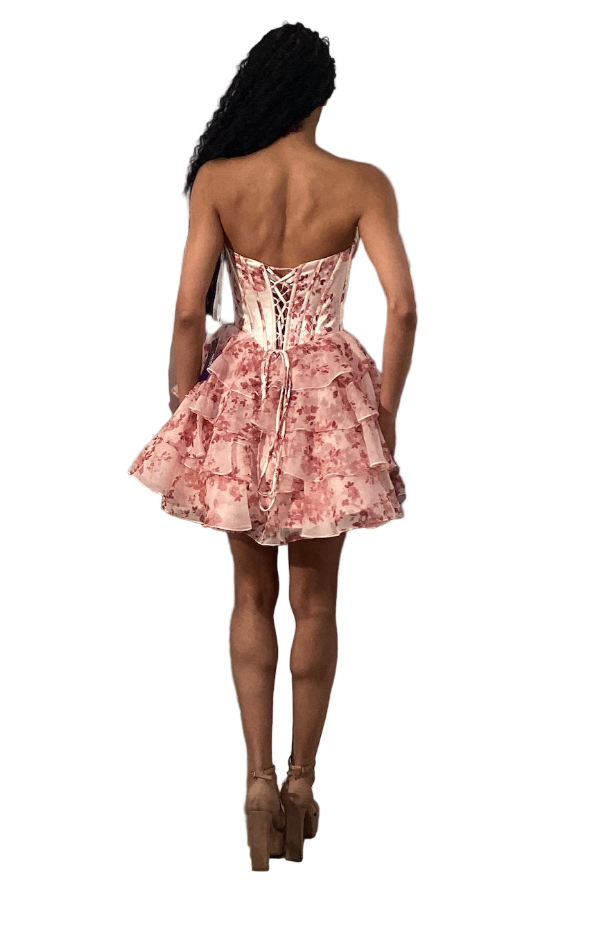 This Jovani 48771 homecoming dress features a flattering fit-and-flare silhouette with a corset bodice for structured support. The short, A-line skirt is enhanced with delicate ruffles and a vibrant floral print, creating a youthful yet elegant look. Crafted with lace accents, this cocktail dress balances sophistication and playful charm, making it an ideal choice for memorable celebrations and formal events.
Sizes: 00-24
Colors: Blue Print, Blush Print, Green Print