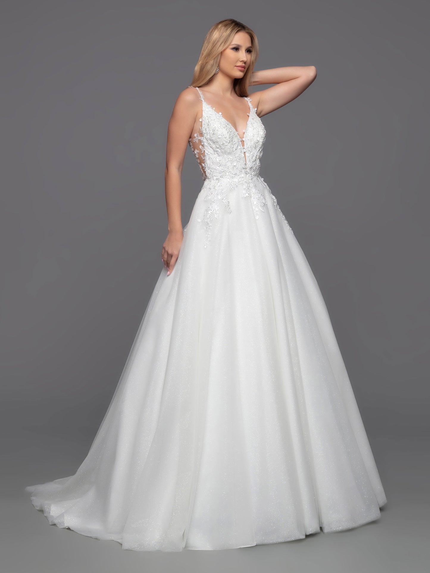 Davinci Bridal 50801 Long Shimmer Tulle Ballgown Sheer lace wedding dress Open Back is a timeless choice with a modern twist. This ball gown features a classic layered tulle skirt and a contemporary bodice with sheer sides, a low keyhole and covered button detail. The perfect combination of style and sophistication for any special occasion. Sizes: 2-20 Colors: Ivory