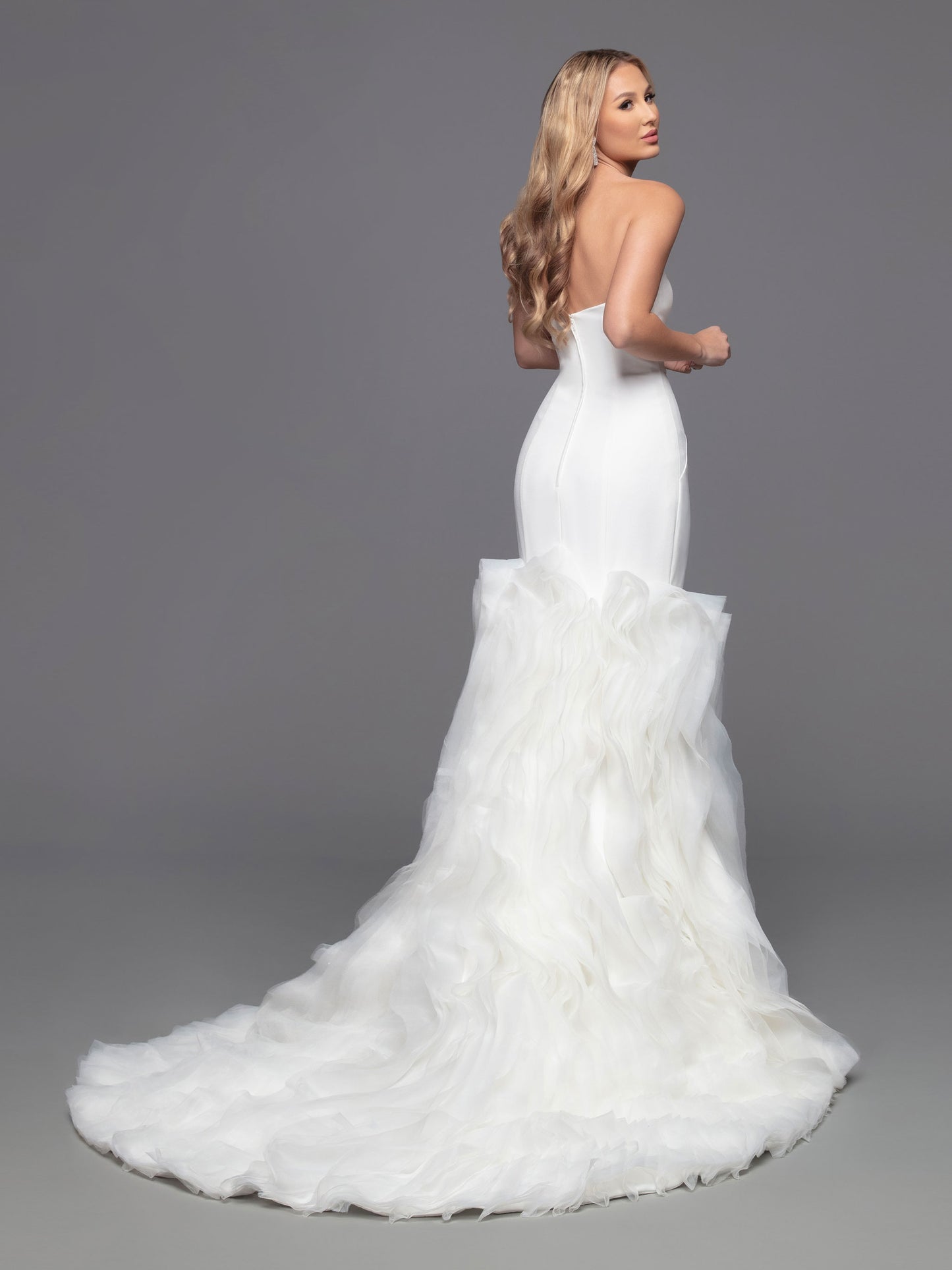 Look truly striking with Davinci Bridal 50802, a strapless crepe mermaid dress featuring a dramatic full skirt of ruffled organza. Enjoy timeless elegance with a contemporary twist in this figure-enhancing gown. Sizes: 2-20 Colors: Ivory