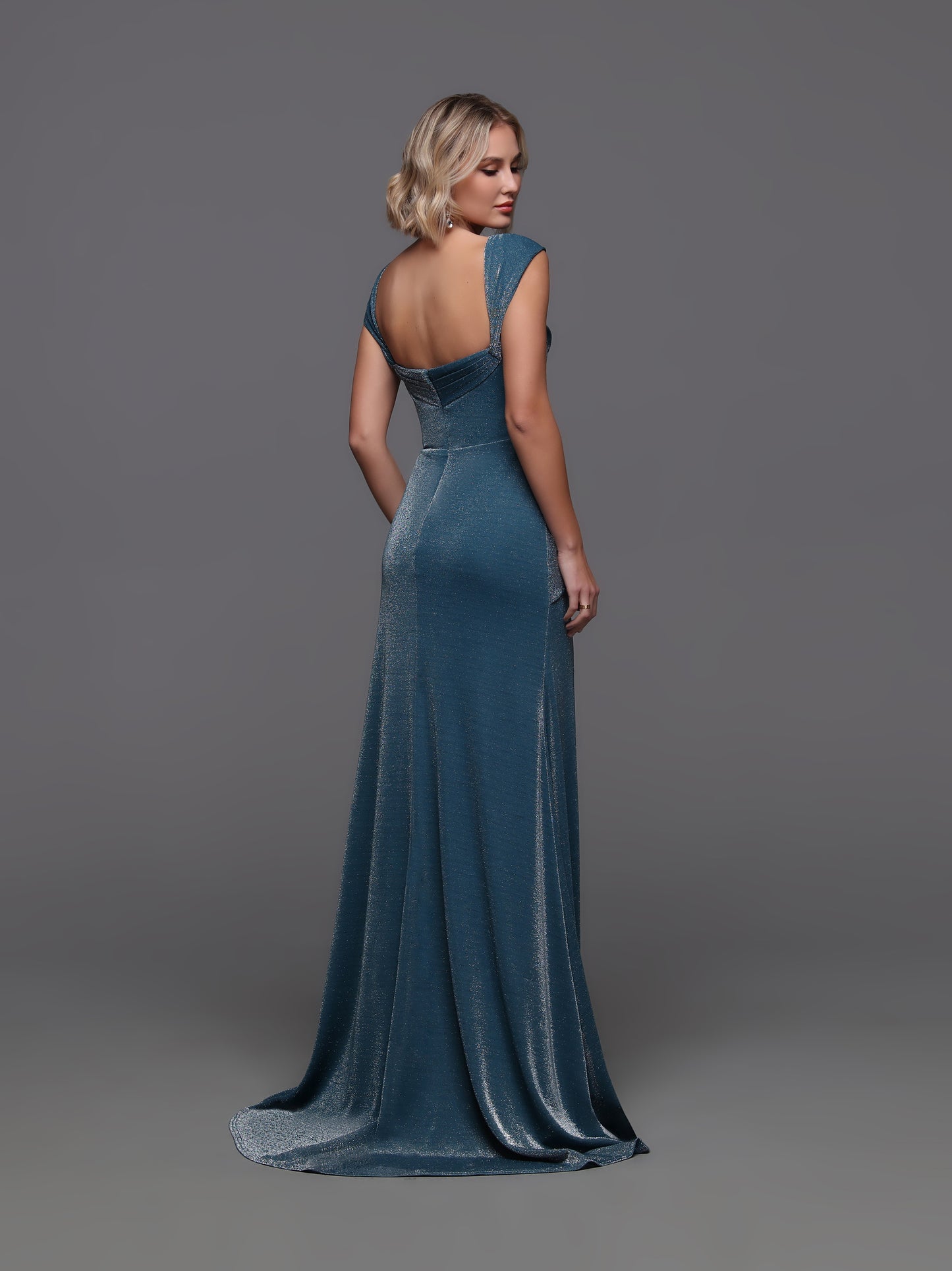 Turn heads in this daring teal shimmer gown featuring a long, fitted silhouette that flatters every curve. The cap sleeves add a touch of elegance, while the dramatic ruffle slit gives a bold edge for confident evening wear. Perfect for making a lasting impression at any formal event.
Size: 10
Color: Teal