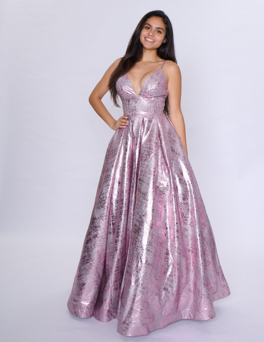 Elevate your formal attire with the Nina Canacci Metallic Ballgown. Stunningly designed with a corset-style bodice and V-neckline, this A-line gown exudes elegance and grace. Made with a metallic fabric, it adds a touch of shimmer to your look. Perfect for prom or any formal event, this dress will make you feel like royalty.
Sizes: 2-18
Colors: Black, Aqua, Rose