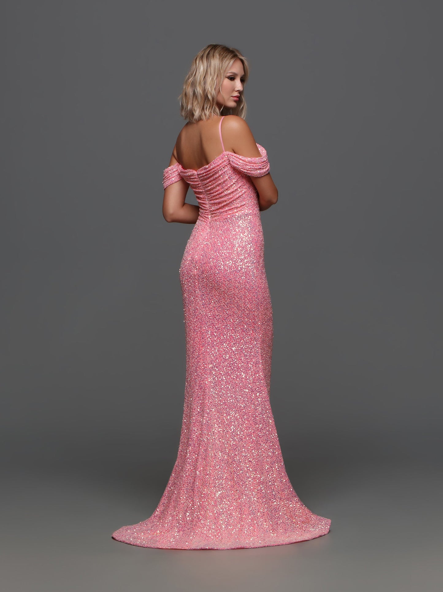 The Candice Wang 72335 Prom Dress is the perfect blend of glamour and sophistication. The sequin corset adds a touch of sparkle, while the high slit and off the shoulder design exude elegance. The scoop neck and ruched details create a flattering silhouette. Elevate your prom night with this stunning dress. Sizes: 0-20 Colors: Neon Pink