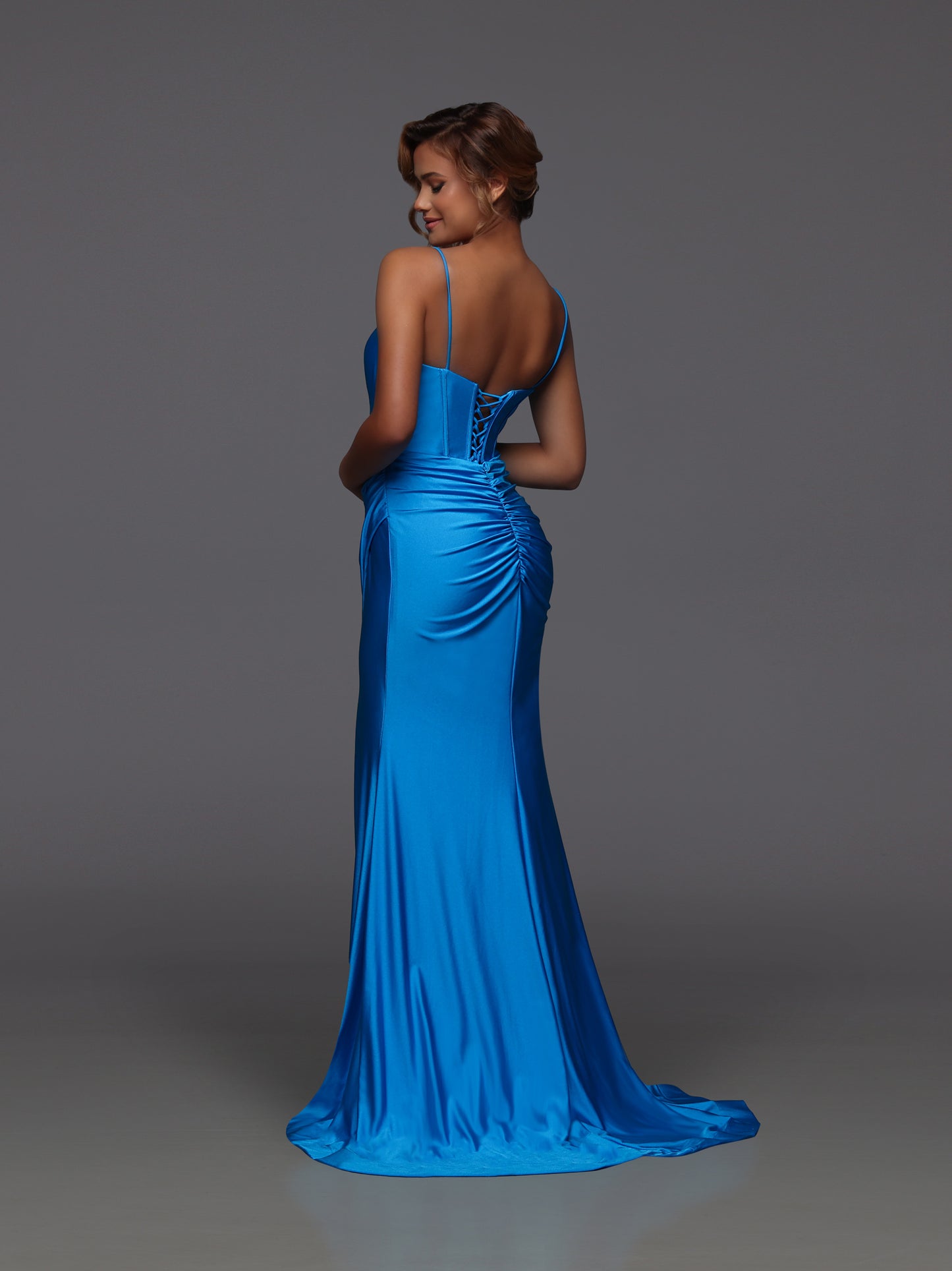 Turn heads in the Candice Wang 72442 prom dress, crafted to hug your silhouette in a striking peacock hue. This long, fitted gown features a dazzling crystal-embellished V-neck and a flattering corset design that sculpts your figure. The ruched fabric adds texture while the high slit offers a bold, confident edge—perfect for making a memorable entrance at your next event.
Size: 10
Colors: Peacock