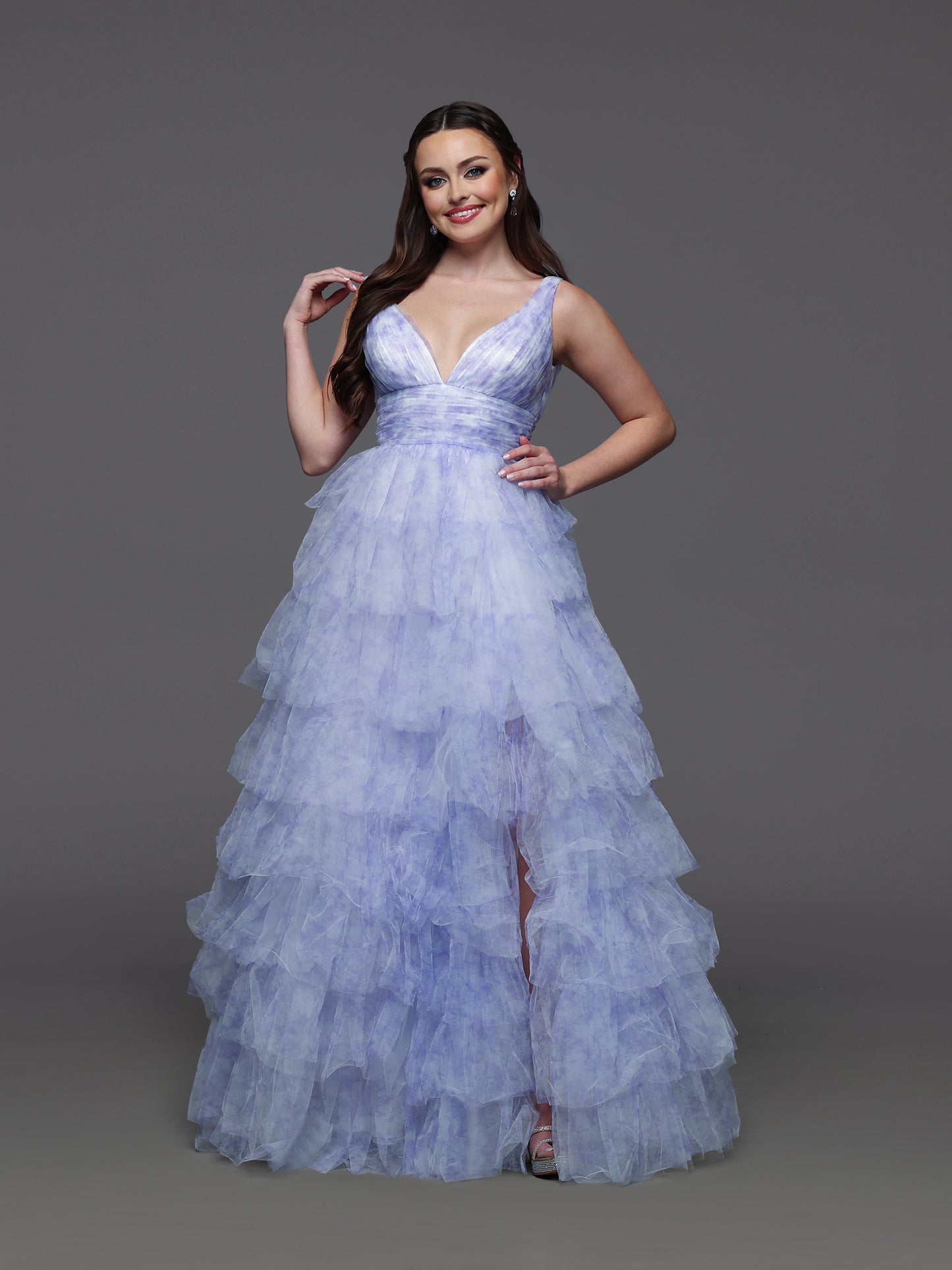 Step into elegance with the Candice Wang 72472 ballgown, designed in a delicate lavender and ivory palette. This size 2 dress features layered ruffles and a charming bow print that add a whimsical touch to your formal look. The flowing silhouette and tasteful slit offer both grace and comfort, making it perfect for prom or any special occasion where you want to stand out beautifully.
Size: 2
Color: Lavender/Ivory