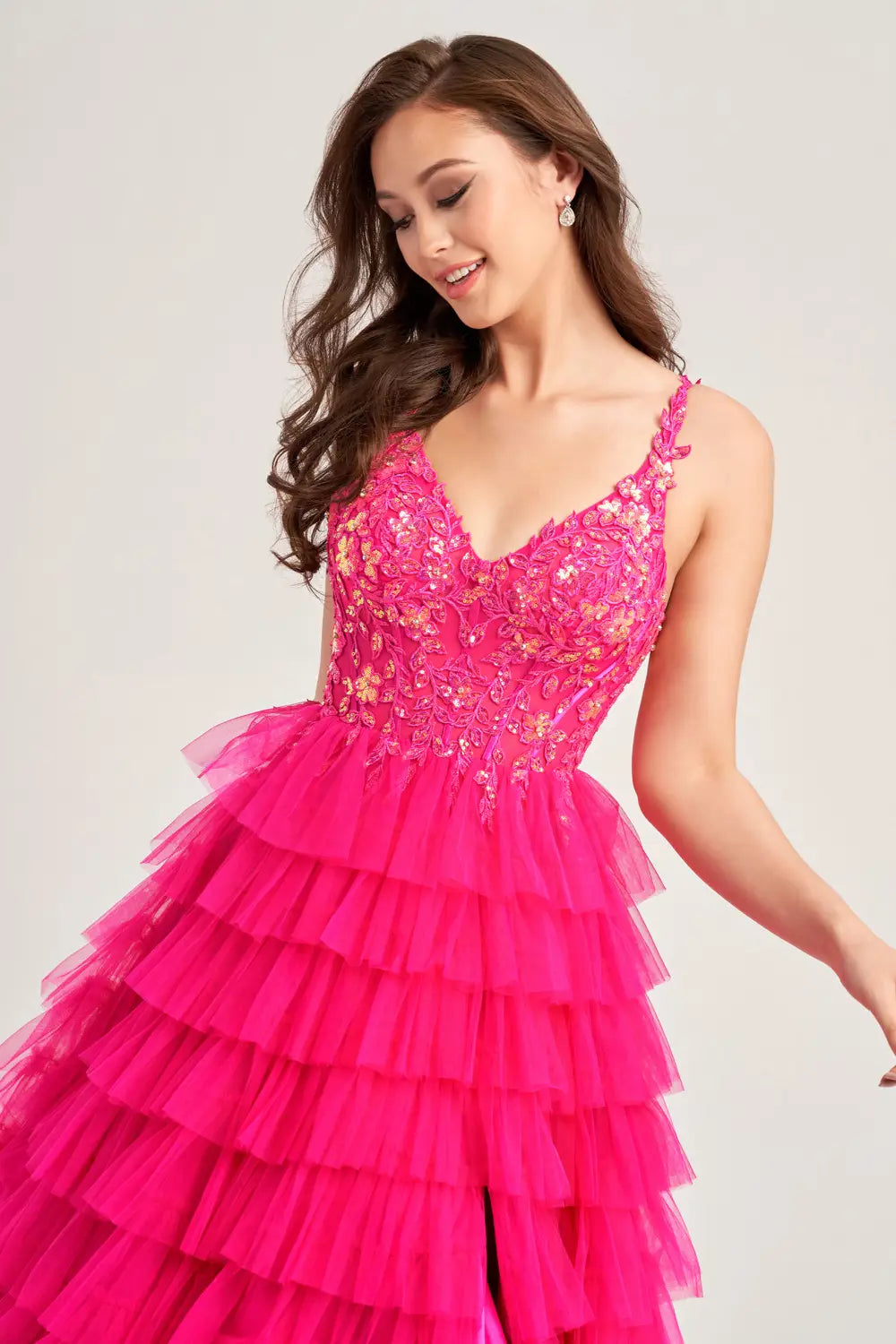 This Ellie Wilde EW35059 prom dress exudes elegance and glamour. The long tulle layers, A-line silhouette, and lace Sequin corset enhance your natural curves, while the maxi slit and sequin details add a touch of sparkle. Perfect for prom or any formal event, this dress is sure to make a statement. Sizes: 00-20 Colors: BLACK, MAGENTA, ROYAL BLUE, BARBIE PINK