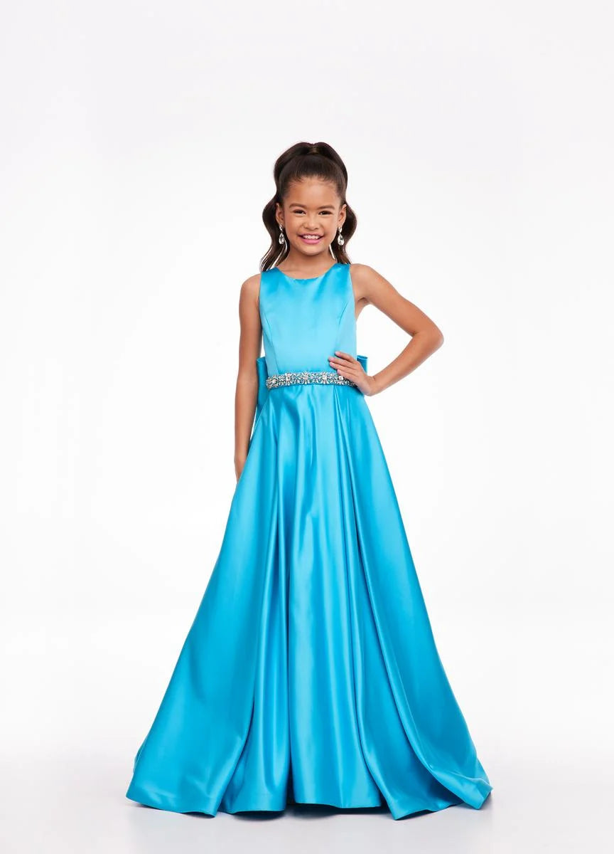 This Ashley Lauren 8079 Size 12 Ivory Long satin A Line girls Pageant Dress features an elegant crew neckline, a crystal encrusted waistline, and an A-line skirt that is complemented by a detachable bow at the back. Perfect for formal occasions, this high-quality gown will make your little girl look beautiful. Size: 12 Color: Ivory