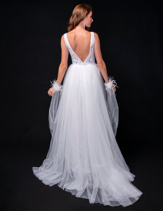 <p data-mce-fragment="1">This stunning Nina Canacci 8224 long, fitted pageant dress features a dazzling sequin design and a detachable tulle overskirt with a feather cuff. The elegant V-neckline adds a touch of sophistication to this show-stopping gown. Perfect for any formal event or pageant, this dress is sure to make a statement.</p> <p data-mce-fragment="1"> </p>