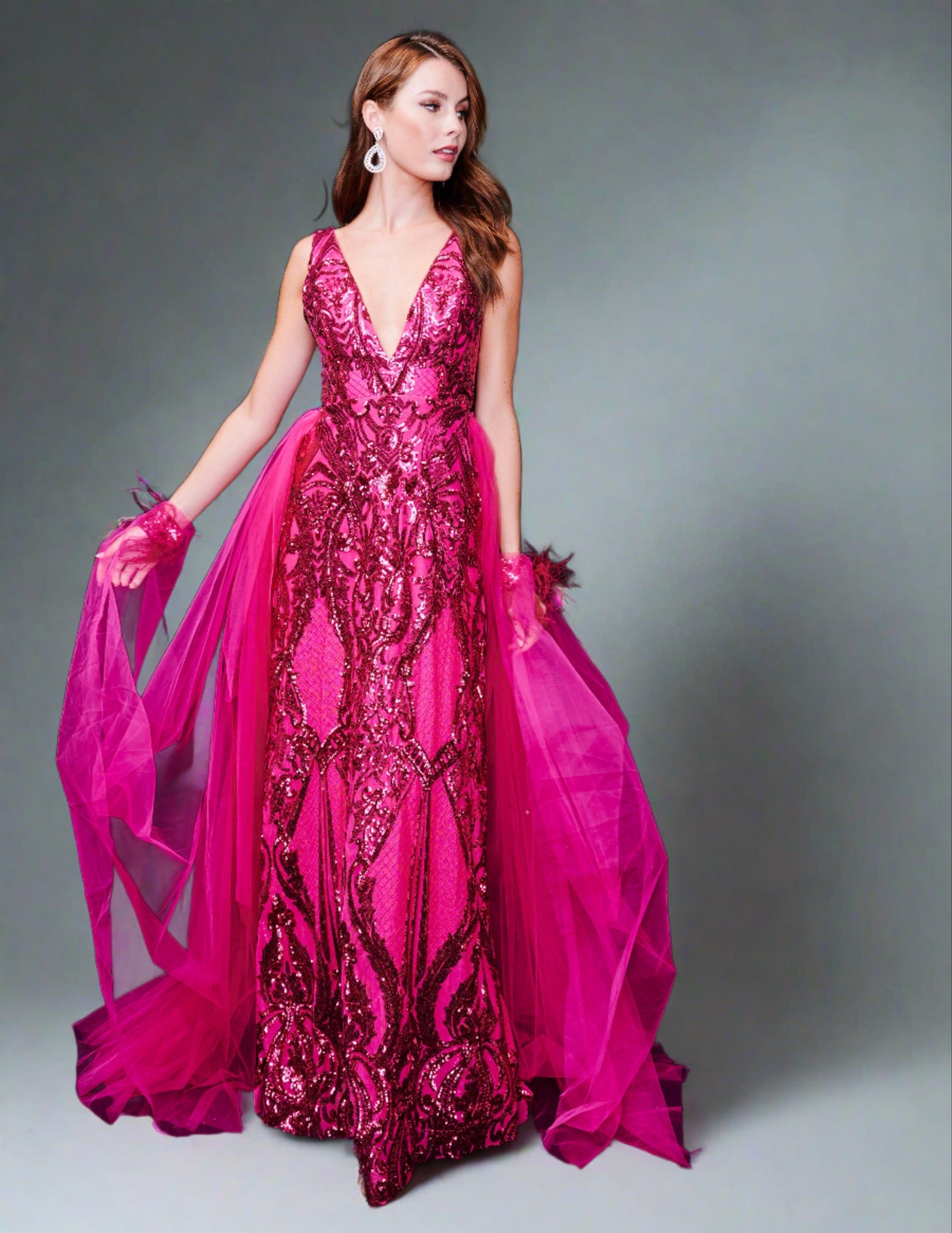 <p data-mce-fragment="1">This stunning Nina Canacci 8224 long, fitted pageant dress features a dazzling sequin design and a detachable tulle overskirt with a feather cuff. The elegant V-neckline adds a touch of sophistication to this show-stopping gown. Perfect for any formal event or pageant, this dress is sure to make a statement.</p> <p data-mce-fragment="1"> </p>