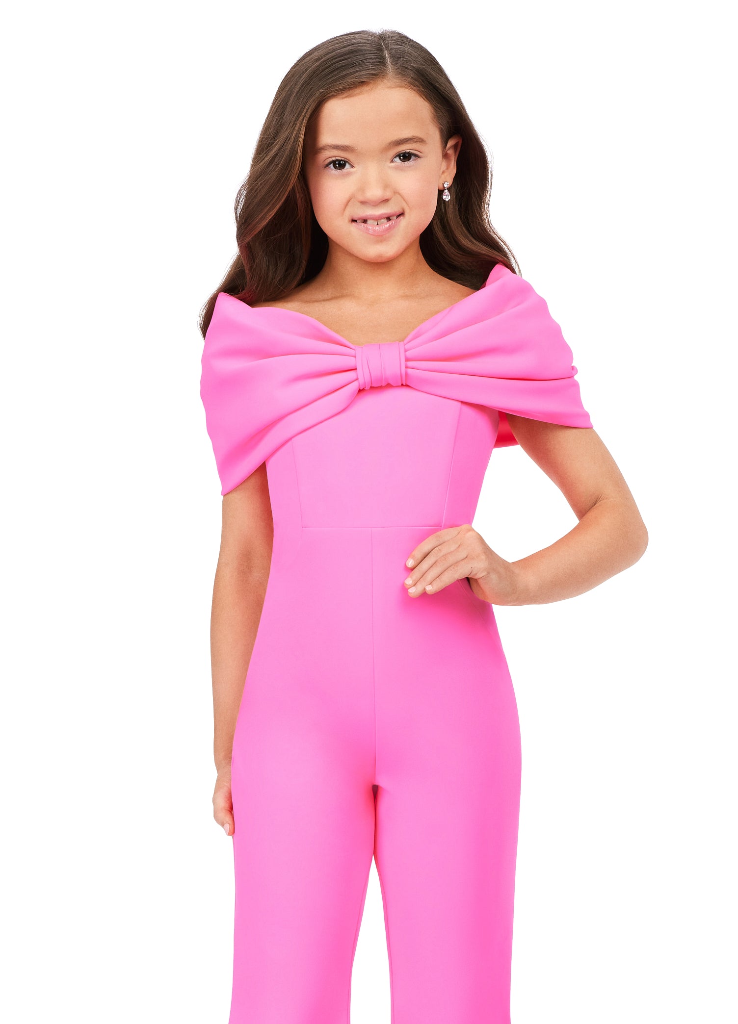 She'll be the talk of the town in the Ashley Lauren Kids 8227 Jumpsuit. Crafted from scuba material, this fashionable design features an off-shoulder bodice with an oversized bow and flare pant legs for a modern touch. Perfect for any special occasion.  Sizes: 4-16  Colors: Red, Hot Pink, Turquoise, White/Black