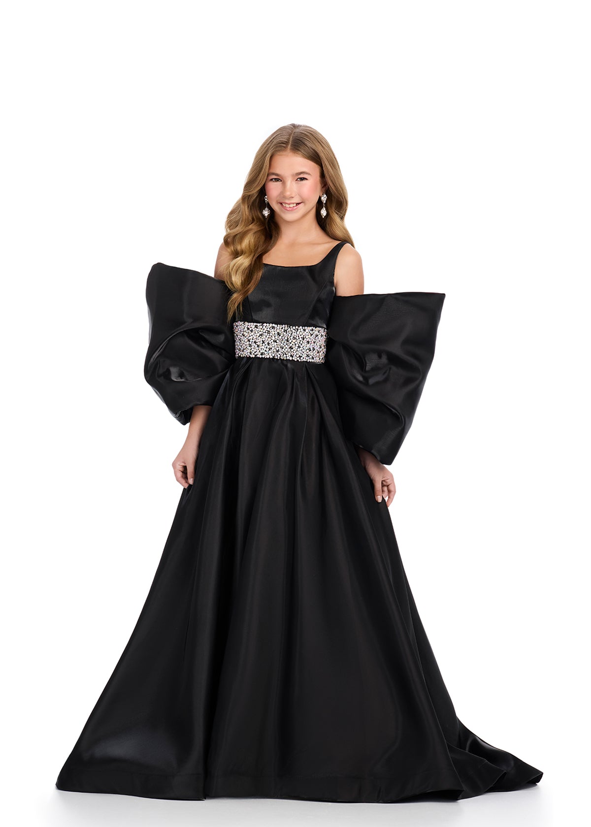 Introducing the Ashley Lauren Kids 8321 Oversize Bow Overskirt Pageant Accessory off the Shoulder Cape - the perfect addition to any pageant ensemble. The oversized bow and off the shoulder design add a touch of elegance and modernity to any outfit. Feel confident and glamorous on stage with this versatile accessory. Transform any outfit into a statement piece with this enchanting bow overskirt. This overskirt adds the perfect amount of glamour to any ASHLEYlauren cocktail dress, jumpsuit or dress.
B