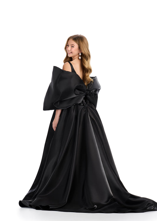 Introducing the Ashley Lauren Kids 8321 Oversize Bow Overskirt Pageant Accessory off the Shoulder Cape - the perfect addition to any pageant ensemble. The oversized bow and off the shoulder design add a touch of elegance and modernity to any outfit. Feel confident and glamorous on stage with this versatile accessory. Transform any outfit into a statement piece with this enchanting bow overskirt. This overskirt adds the perfect amount of glamour to any ASHLEYlauren cocktail dress, jumpsuit or dress.
B