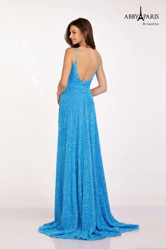 Be the center of attention in the Abby Paris 90247 A Line Velvet Sequin Ballgown. This stunning dress features a V-neckline and A-line silhouette that flatters any figure. The velvet fabric and sequin embellishments add a touch of luxury, while the maxi slit and pockets provide practicality. Perfect for prom or any formal event. Sizes: 0-20 Colors: Dolphin Blue, Magenta