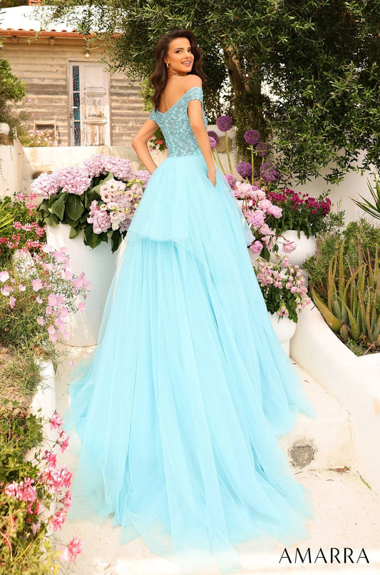 This dazzling prom dress radiates charm, romance and magic - all ingredients for a perfect prom night. The bodice is magnificently designed with labyrinthine rhinestone detail, highlighted by the off-the-shoulder sleeve and flirtatious sweetheart neckline that will capture the attention of anyone that beholds you. However, that is not the main piece of this gorgeous attire.