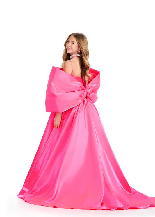 Introducing the Ashley Lauren Kids 8321 Oversize Bow Overskirt Pageant Accessory off the Shoulder Cape - the perfect addition to any pageant ensemble. The oversized bow and off the shoulder design add a touch of elegance and modernity to any outfit. Feel confident and glamorous on stage with this versatile accessory. Transform any outfit into a statement piece with this enchanting bow overskirt. This overskirt adds the perfect amount of glamour to any ASHLEYlauren cocktail dress, jumpsuit or dress.