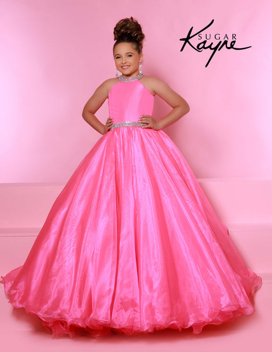 Sugar Kayne C114 by Johnathan Kayne is an Organza Girls Ball Gown Pageant Dress. Featuring a high neckline with crystal rhinestone accents. The waist line is broken with a crystal bling belt. The lush Ball gown skirt features a horse hair trim. Glide across the stage in the classic beauty!
Available Colors: Aqua, Barbie Pink, Jade, Lilac, Neon Orange, Royal, Ruby Red, White, Yellow
Available Size: 2-16
(Sizes 2-6 do not have bust cups, Sizes 8-16 will have preteen size bust cups)