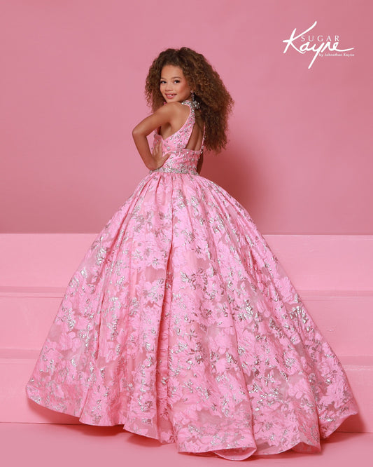 Designer: Sugar Kayne — Style C404
Sugar Kayne style C404 is a classic girls pageant dress with layered organza and a smooth satin lining for beautiful volume and shine. The full skirt and refined bodice give this gown timeless pageant appeal, making it ideal for everything from local titles to national stages.
Sizes: 2–16
Colors: Metallic Blue, Metallic Pink