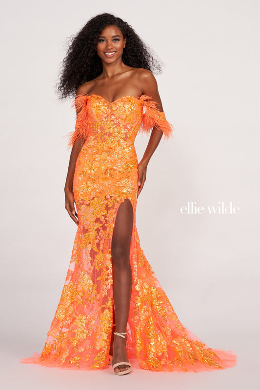 The Ellie Wilde EW34034 is a glamorous formal gown featuring an off-the-shoulder neckline, corset bodice, and a full-length sheer sequin skirt with a side slit. Festooned with a beautiful feather trim, this dress is sure to make a statement. Sizes: 00-16 Colors: ORANGE, ROYAL BLUE, LILAC, HOT PINK, SAPPHIRE, SKY BLUE, EMERALD, PURPLE RAIN