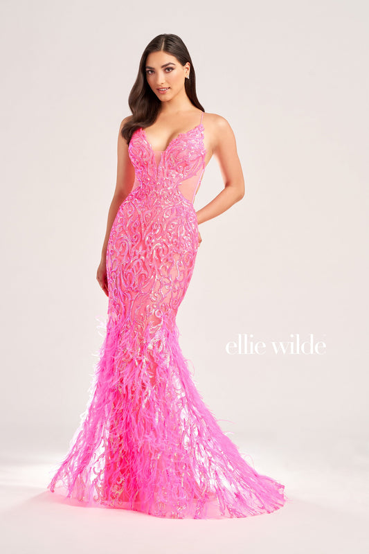 The Ellie Wilde EW35006 Sheer Sequin Prom Dress Gown features a low lace-up back with a side waist mesh inset corset and a glamorous, full-length feather skirt. Look stunning on your special night with this luxurious backless gown. COLOR: ORANGE, CHAMPAGNE, EMERALD, HOT PINK, IRIS SIZE: 00 - 16