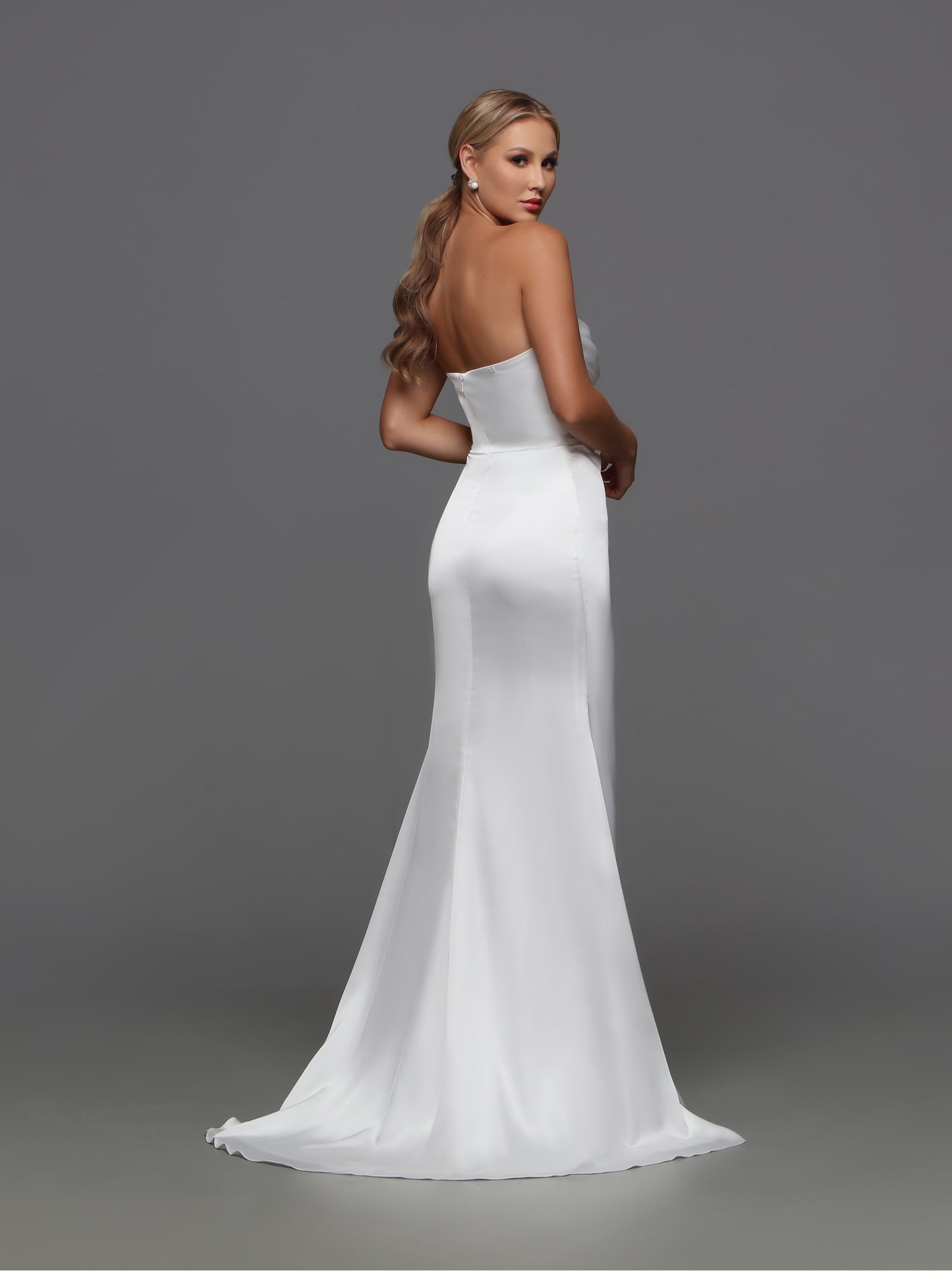 Elevate your wedding style with the Davinci F125 Fitted Satin Wedding Dress. The off the shoulder cape and slit strapless design exude sophistication and luxury. Crafted from high-quality satin, this bridal gown will make you the center of attention. Make a stunning statement on your special day.