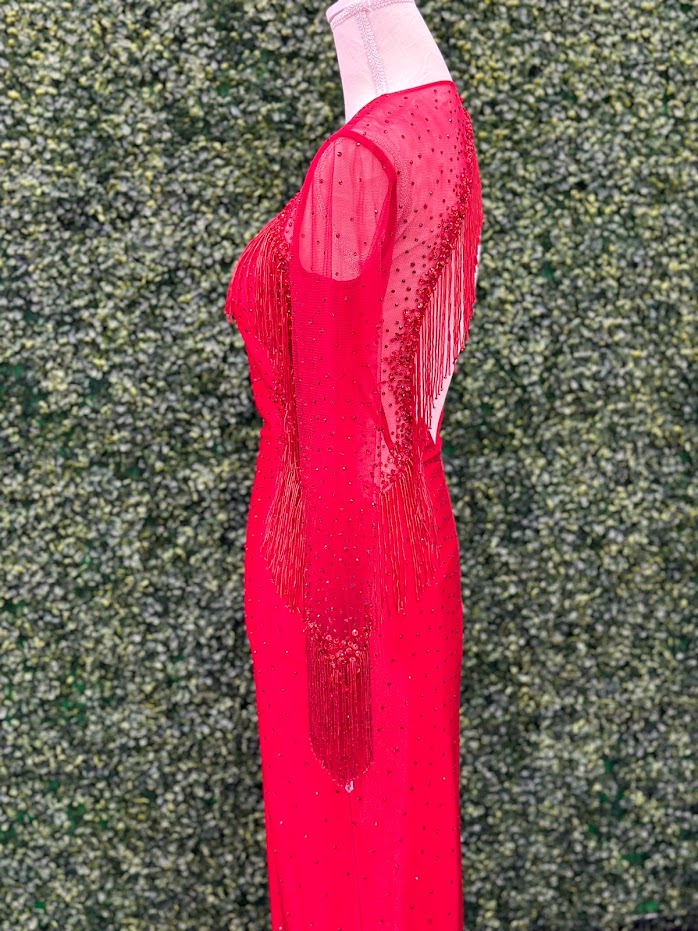The Johnathan Kayne 2795 Size 4 Crystal Sheer Beaded Fringe Long Sleeve Cocktail Dress is crafted from Satin shimmer fabric and features a sheer beaded fringe design. one long sleeve with fringe and crystal accents. This sophisticated take on a classic dress is sure to delight with its delicate elegance. Asymmetrical skirt. * ONE OF A KIND Size: 4 Color: Red