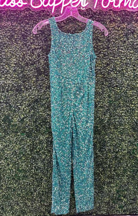 Ashley Lauren Kids 8025 Sparkle at your next event in this mint fully beaded girls pageant jumpsuit. The top has modern tank style straps. The straight leg pants are complete with pockets.  Colors: Mint  Sizes 4, 12