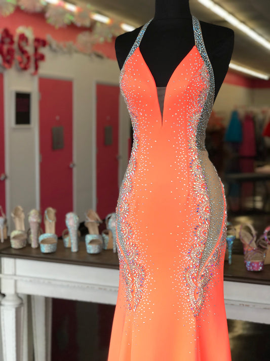 Johnathan Kayne 2690 hand-beading tapers down on the sides and features sheer mesh cut outs Johnathan Kayne 2690 Long Fitted Sheer Crystal Formal Pageant Dress Mermaid Prom Gown Available sizes:00-16 Available colors: Poppy, Lilac