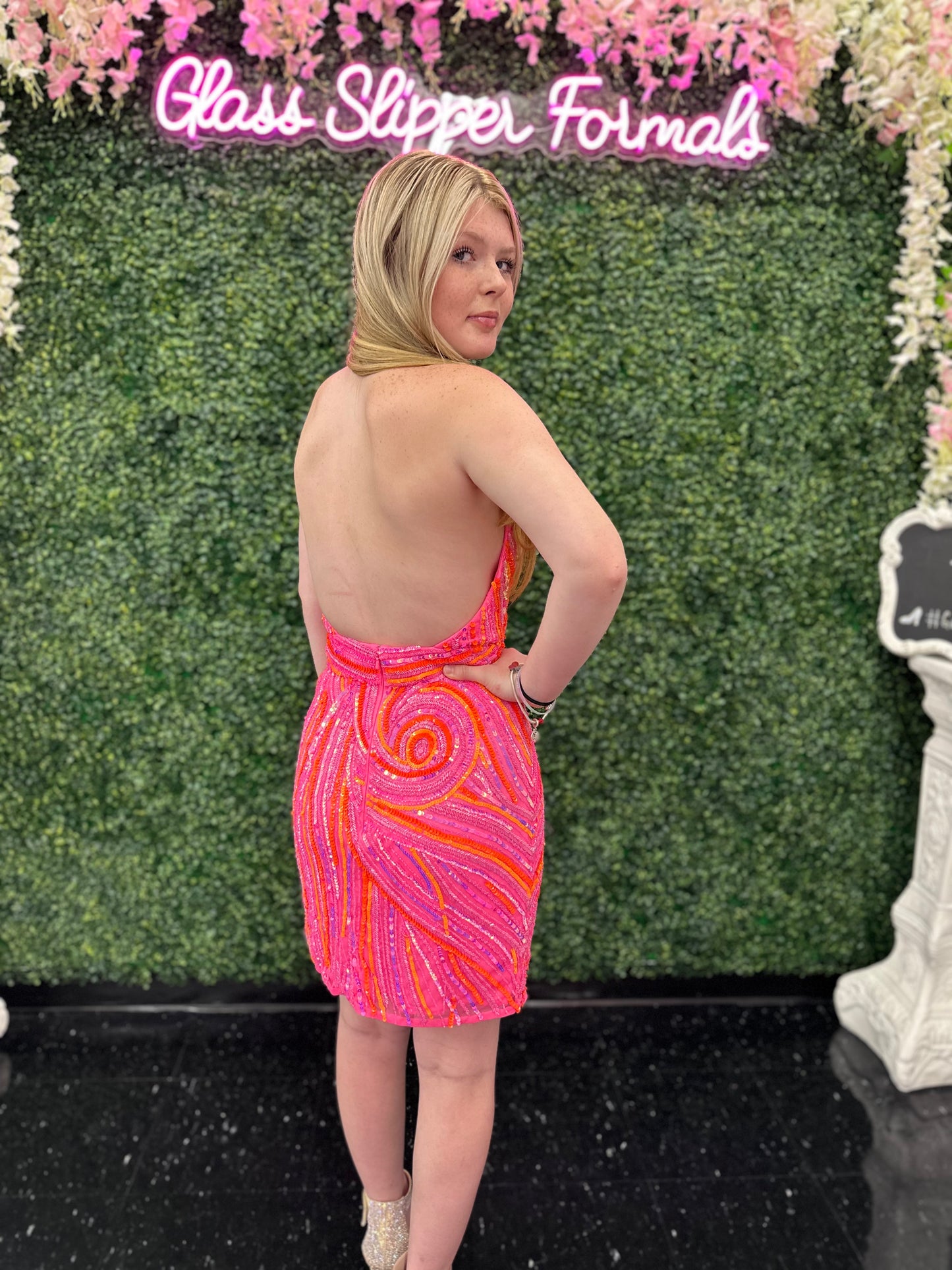 Introducing the Ashley Lauren 4791 Halter Formal Cocktail Dress. With sequins and a backless design, this dress is perfect for formal events and homecoming. Its halter neckline adds an elegant touch, while the short gown shows off your legs. Look and feel amazing in this exclusive piece. Colors: Orchid, Black, Hot Pink, Jade, Royal